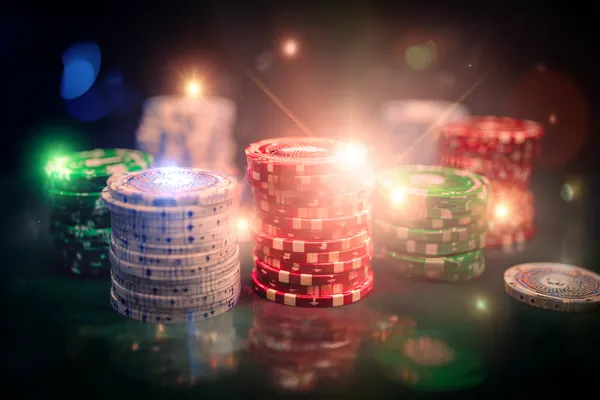 A close-up shot of golden coins falling around a spinning roulette wheel, representing immersive casino action at BAJI200.
