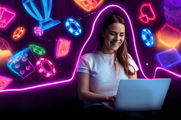 A player using their smartphone during a festive local event, representing BAJI200’s fully mobile-friendly casino.